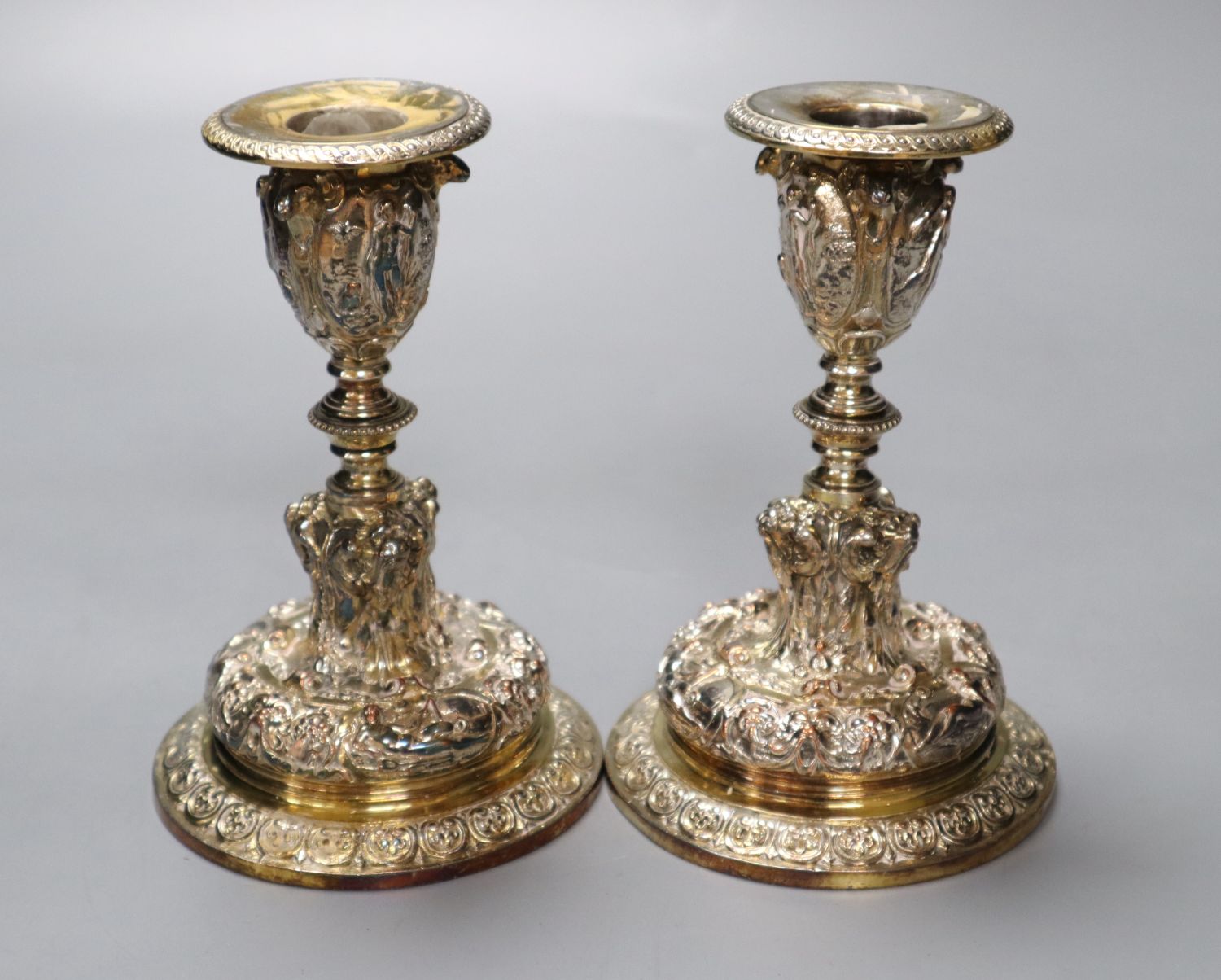 A pair of Elkington electrotype cast plated candlesticks, height 14cm